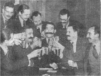 The Handlebar Club toasts member George Hoffman, who is emigrating to Canada with his 8¼-inch moustache.