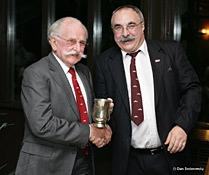 Geoff White accepts the Prime Handlebar cup from Rod
